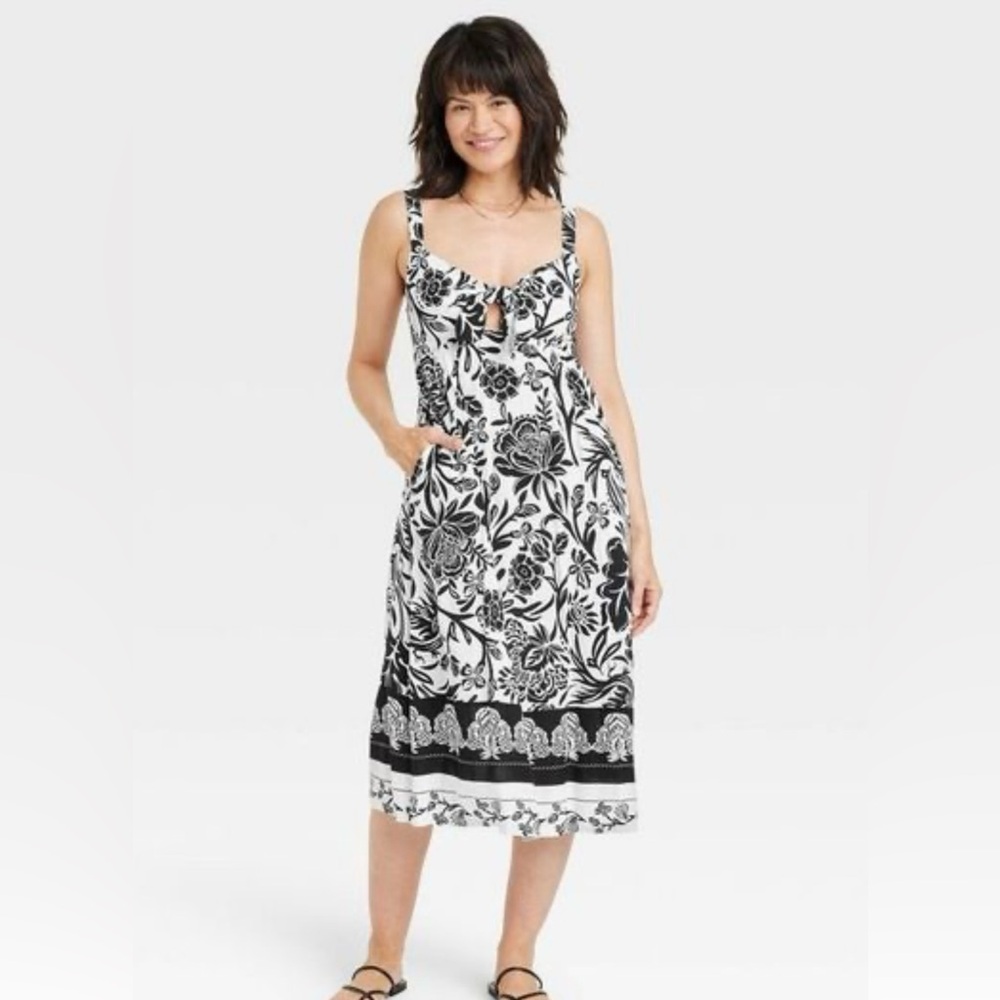 Black and white floral midi dress. With pockets.